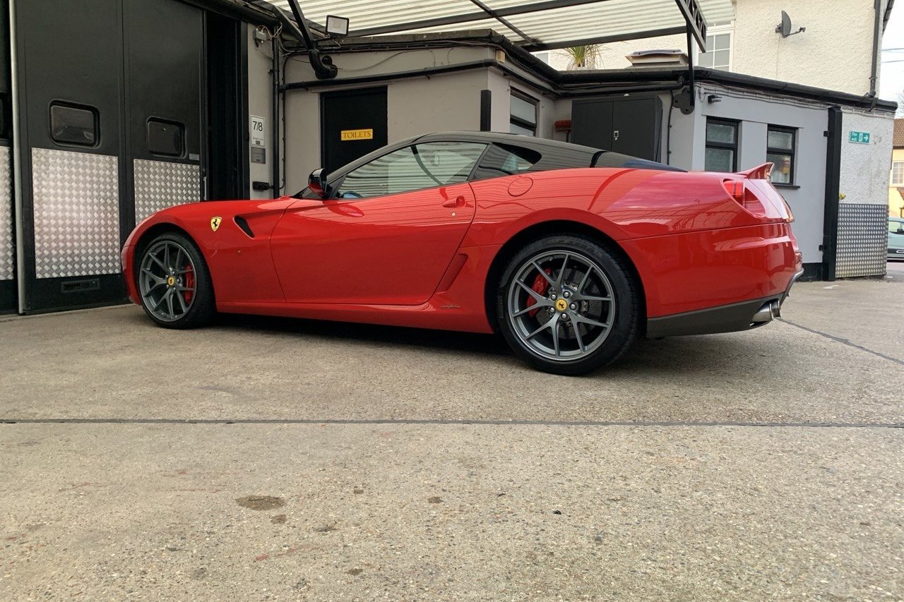 Red Ferrari 599 in side profile at the private Essex storage facility