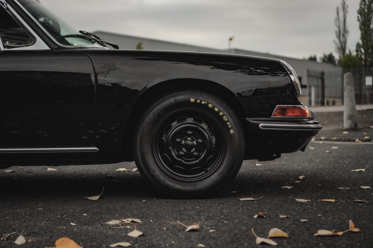 Black classic Porsche on steel wheels, kept in private indoor storage