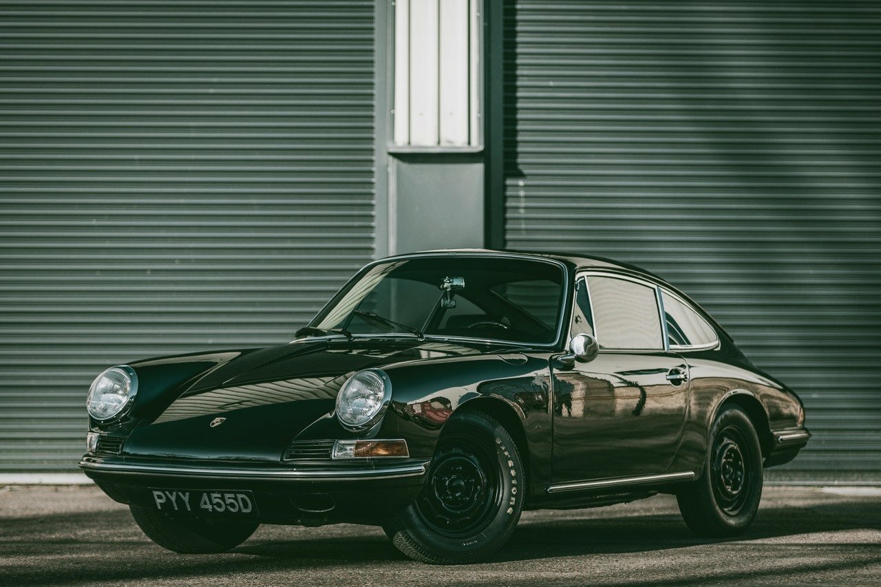 Classic black Porsche 912 outside a secure indoor car storage facility